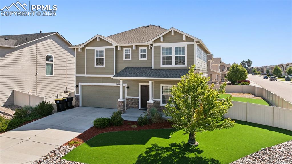 Image 30 of 39: Craftsman-style house with a porch, a shingled roof, concrete driveway, an 