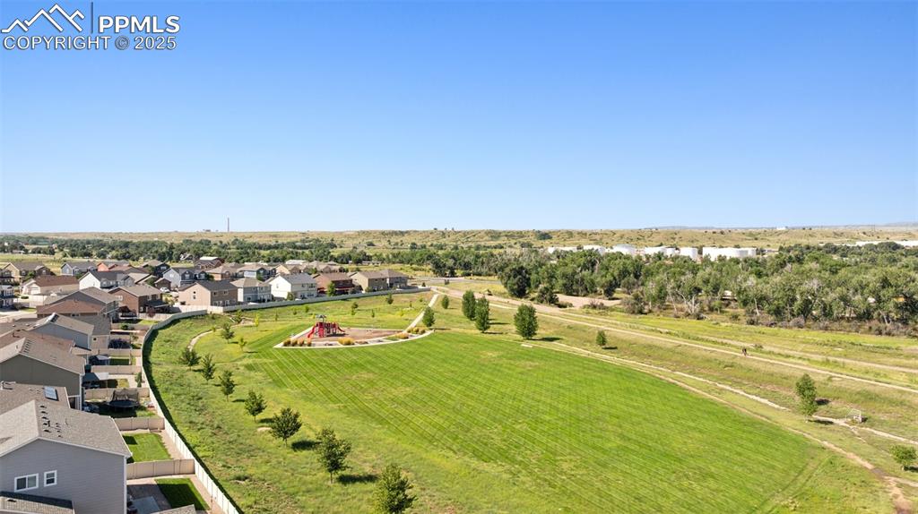 Image 34 of 39: Overview of rural landscape featuring nearby suburban area