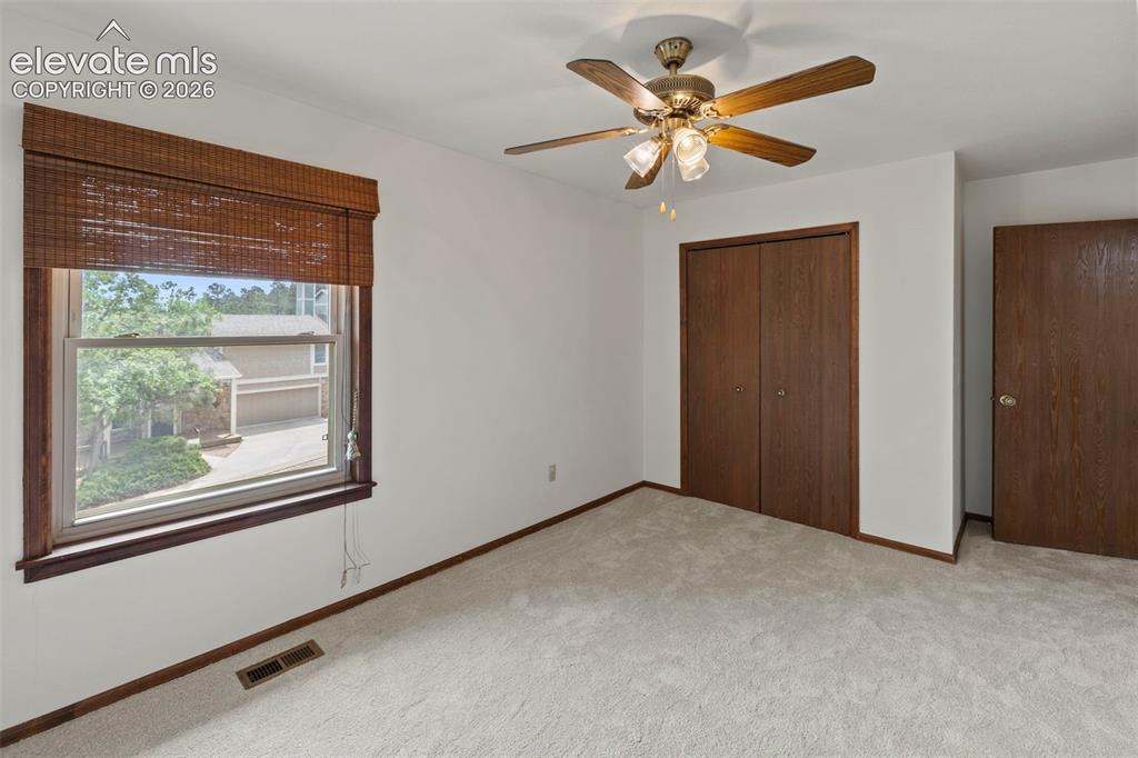 Image 15 of 30: 2nd Upper level bedroom with new carpet and lots of natural light
