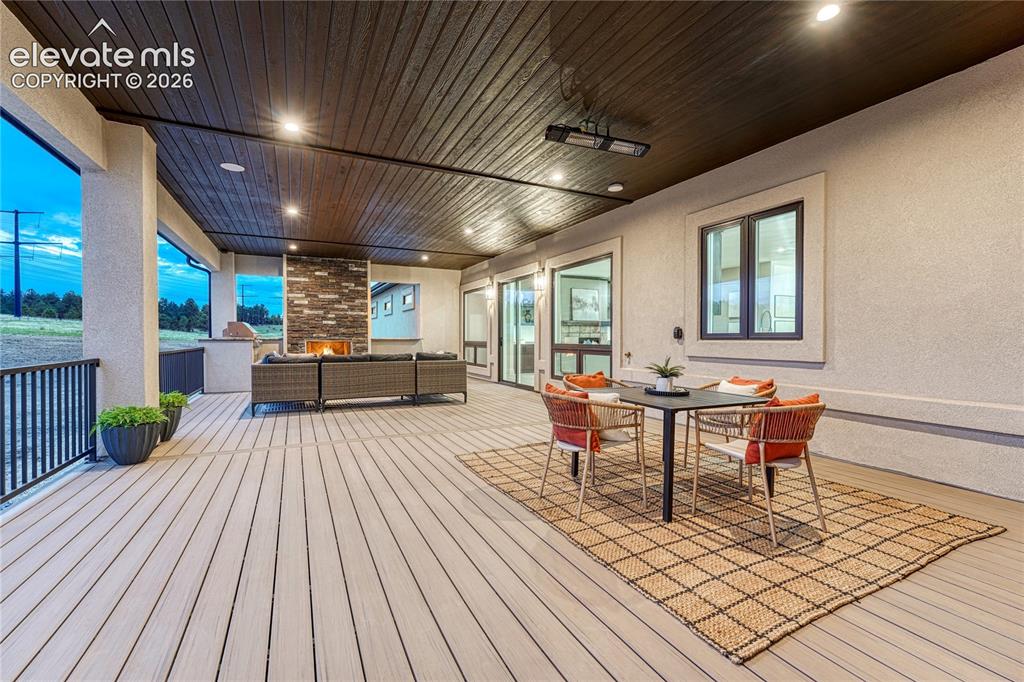 Image 11 of 49: ...ceiling mounted heater and access to primary bedroom and backyard.
