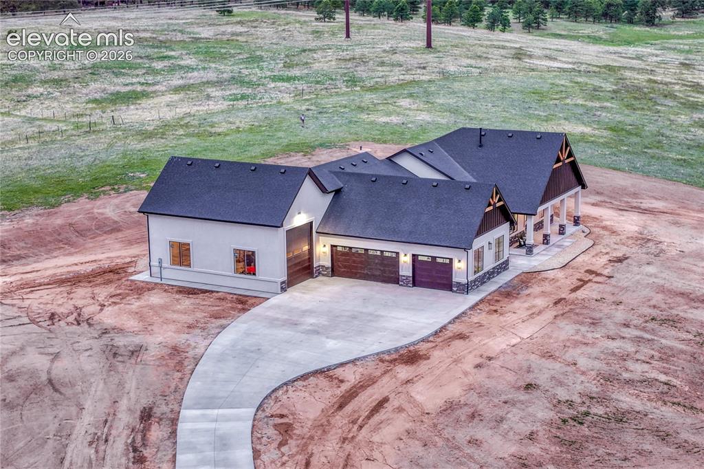 Image 2 of 49: Two distinct living spaces and 4-car with dedicated RV garage.
