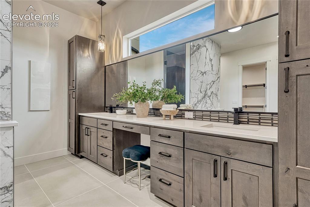 Image 26 of 49: Natural light, ample storage and double vanity.
