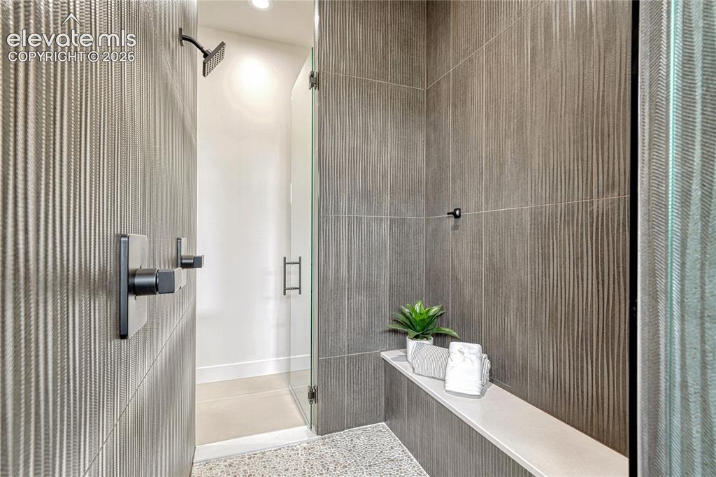 Image 27 of 49: Beautiful tile work in this shower.