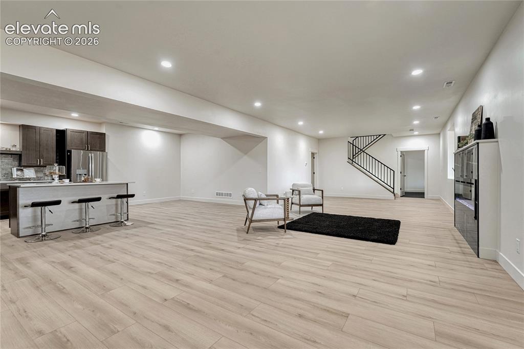 Image 37 of 49: ...and 2 above-grade windows. Open concept with kitchen, great room and din