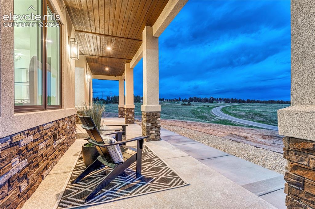 Image 4 of 49: Stunning views from this covered porch...
