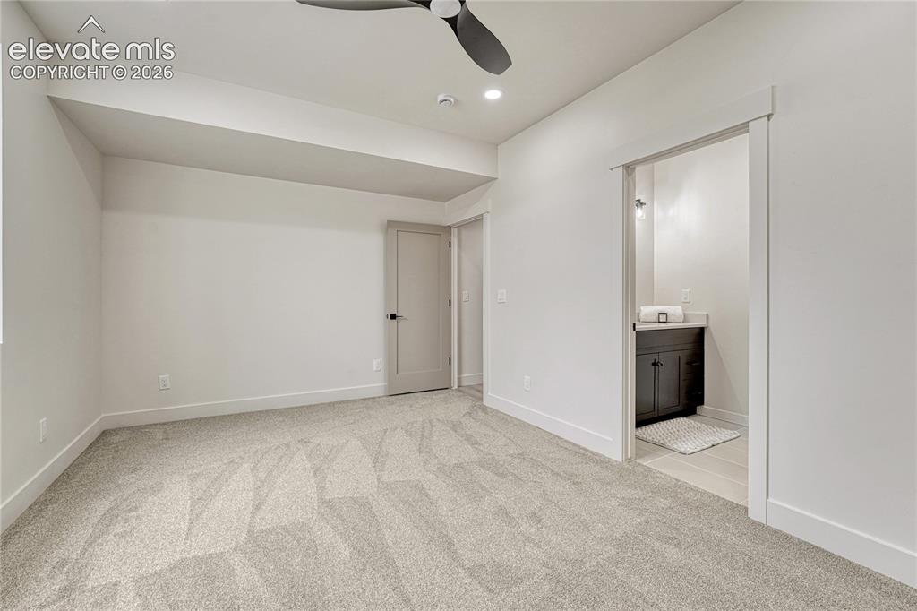 Image 46 of 49: Second of two lower level bedrooms...