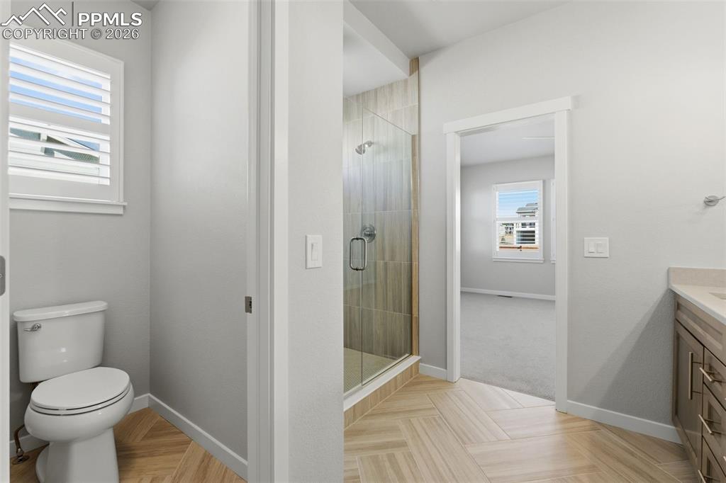 Image 25 of 48: Secondary full bathroom with tub/shower combo, tile surround, and contempor