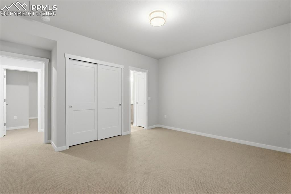 Image 32 of 48: Basement bedroom with neutral carpet, recessed lighting, and spacious close