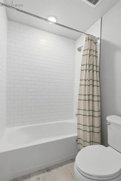 Image 37 of 48: Basement 3/4 bathroom with walk-in shower featuring tile surround and moder