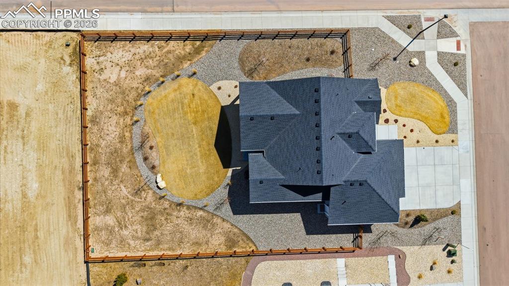 Image 40 of 48: Aerial view of property showing roof layout, 3-car garage, lot lines, and s