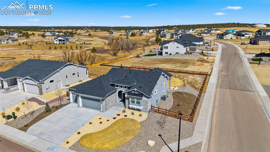 Image 42 of 48: Aerial view showing property and surrounding community with stunning Colora