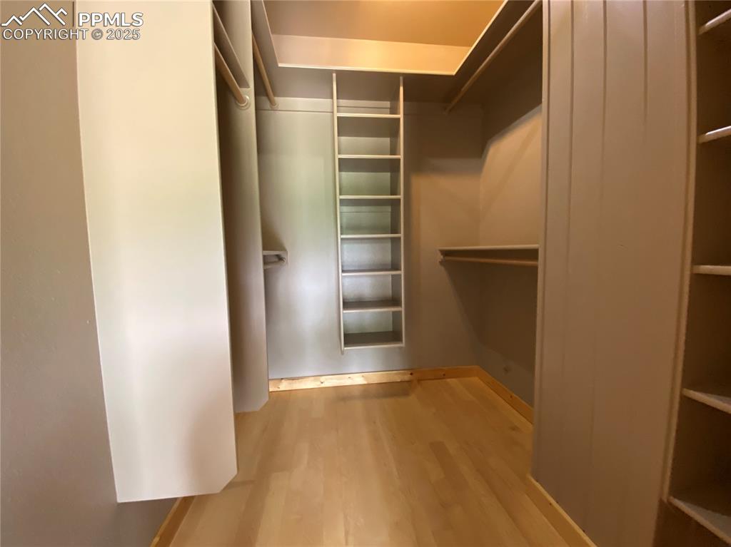 Image 11 of 36: Spacious closet with plenty of room