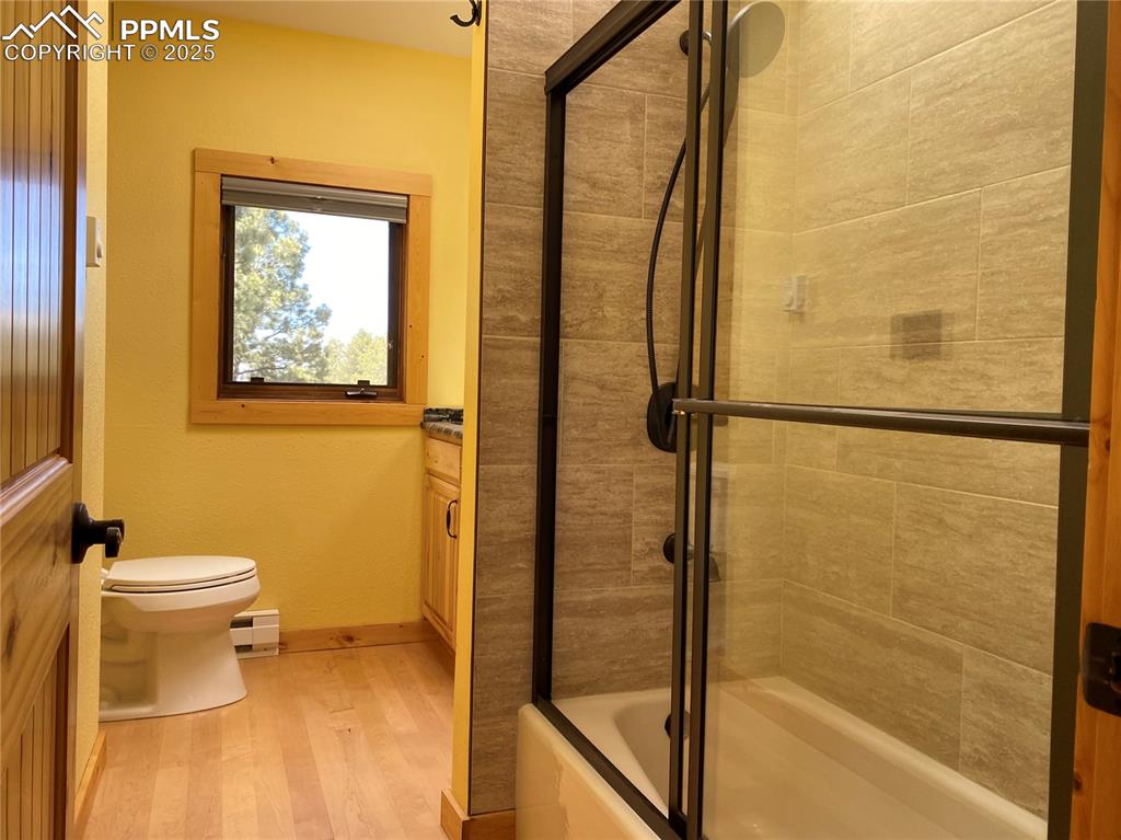 Image 12 of 36: The master bath features custom tilework