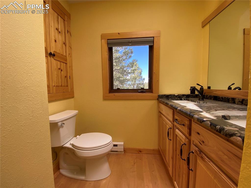 Image 13 of 36: Custom granite countertop and dual vanities