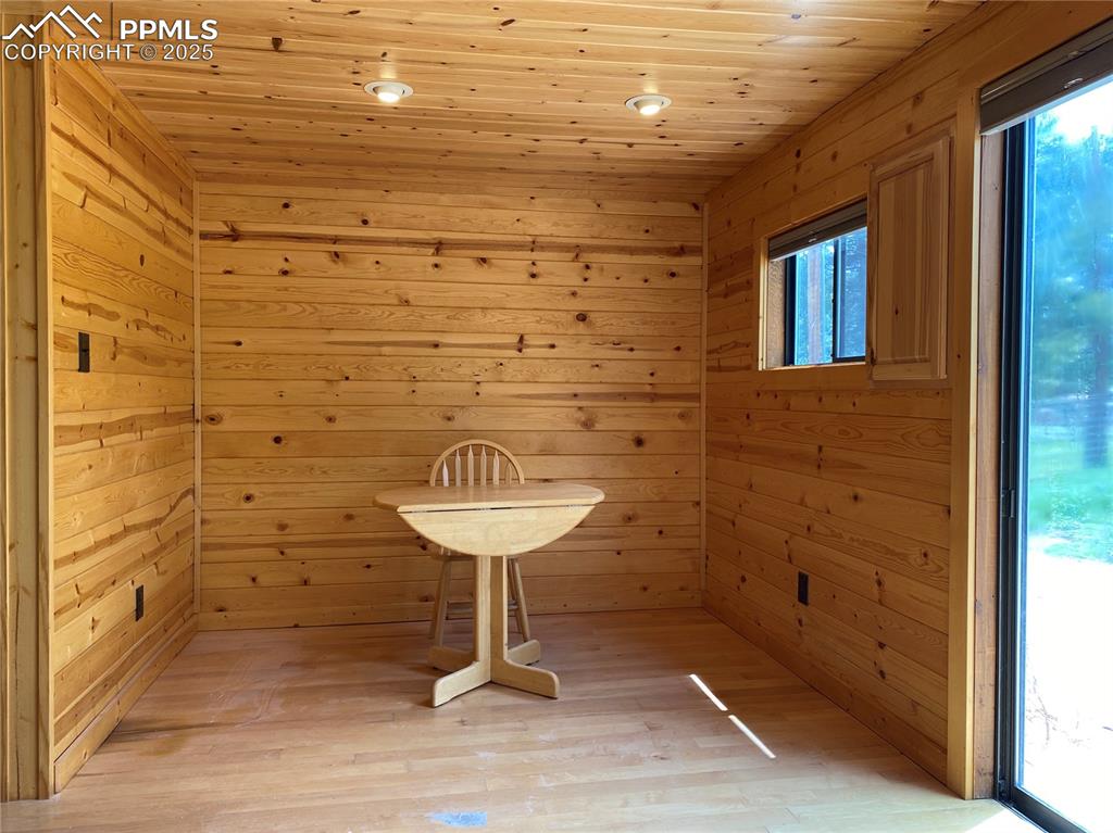 Image 23 of 36: The dining room has maple hard wood flooring and lots of natural light