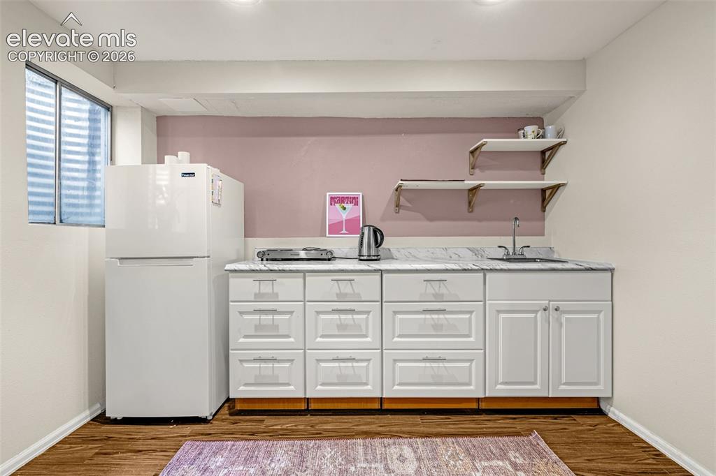 Image 40 of 50: Kitchenette in basement