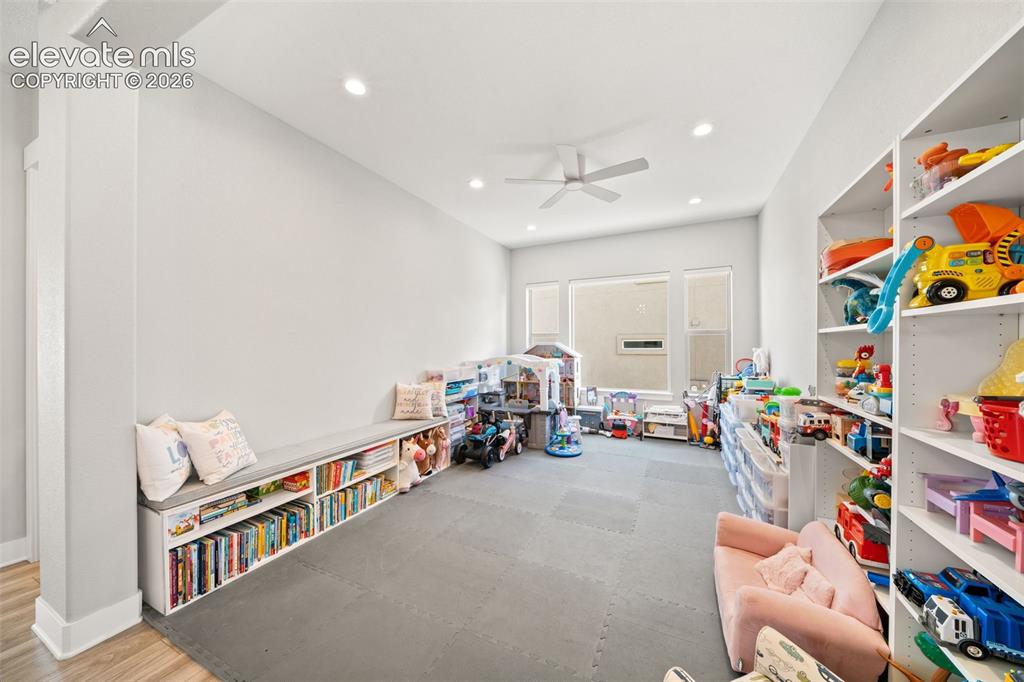Image 28 of 45: Formal dining room or sitting room. Currently utilized as kids play room.