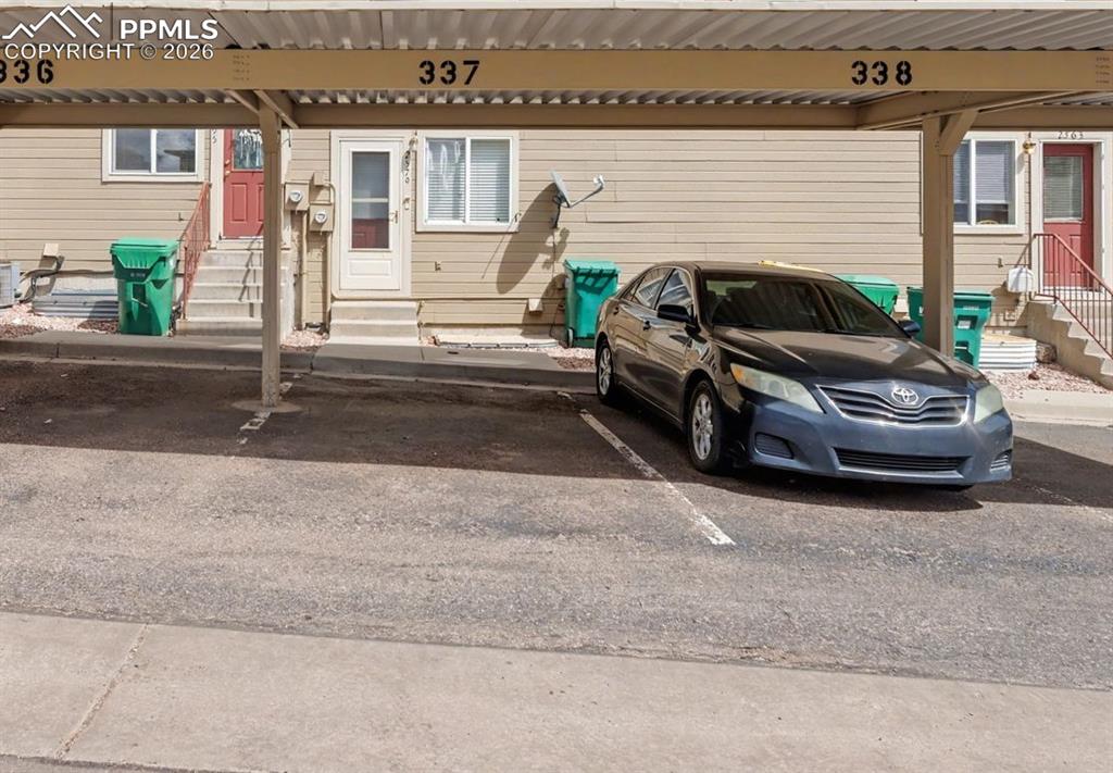 Image 14 of 15: Assigned covered parking space is just outside the back door