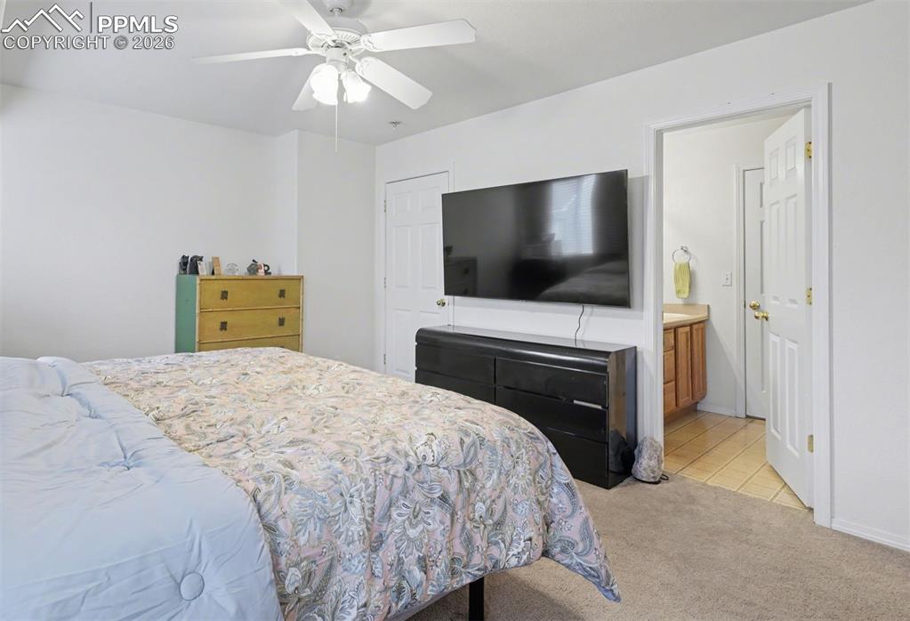 Image 5 of 15: Primary bedroom adjoins full bathroom