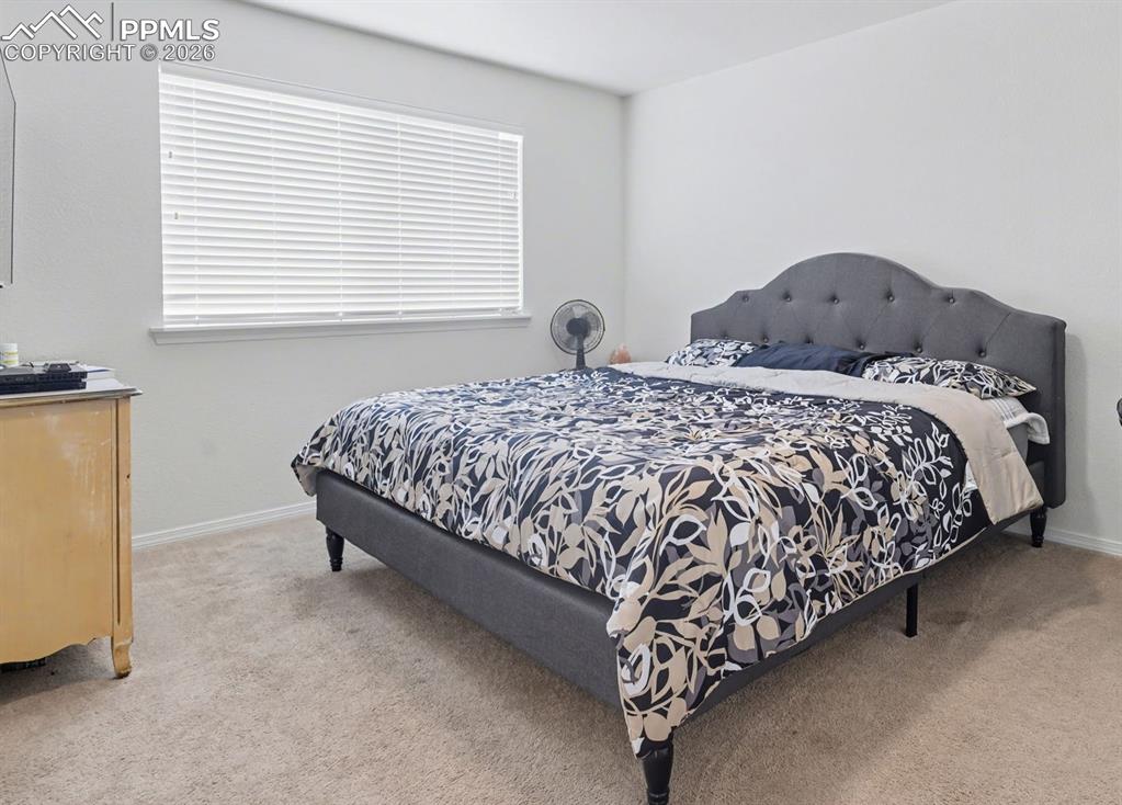 Image 9 of 16: Upper level secondary bedroom adjoins the jack-n-jill full bath