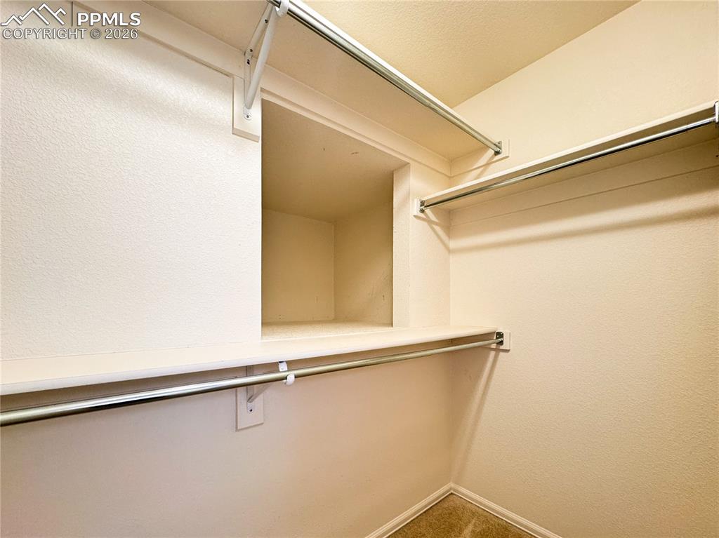 Image 24 of 50: Primary closet