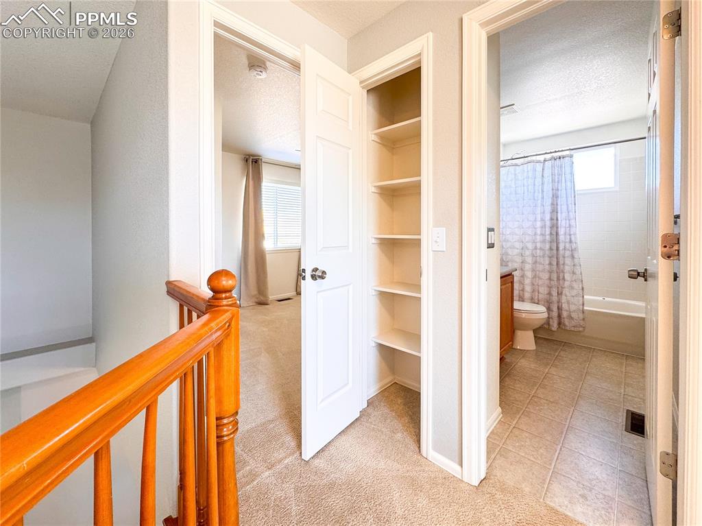 Image 30 of 50: Hall way linen closet