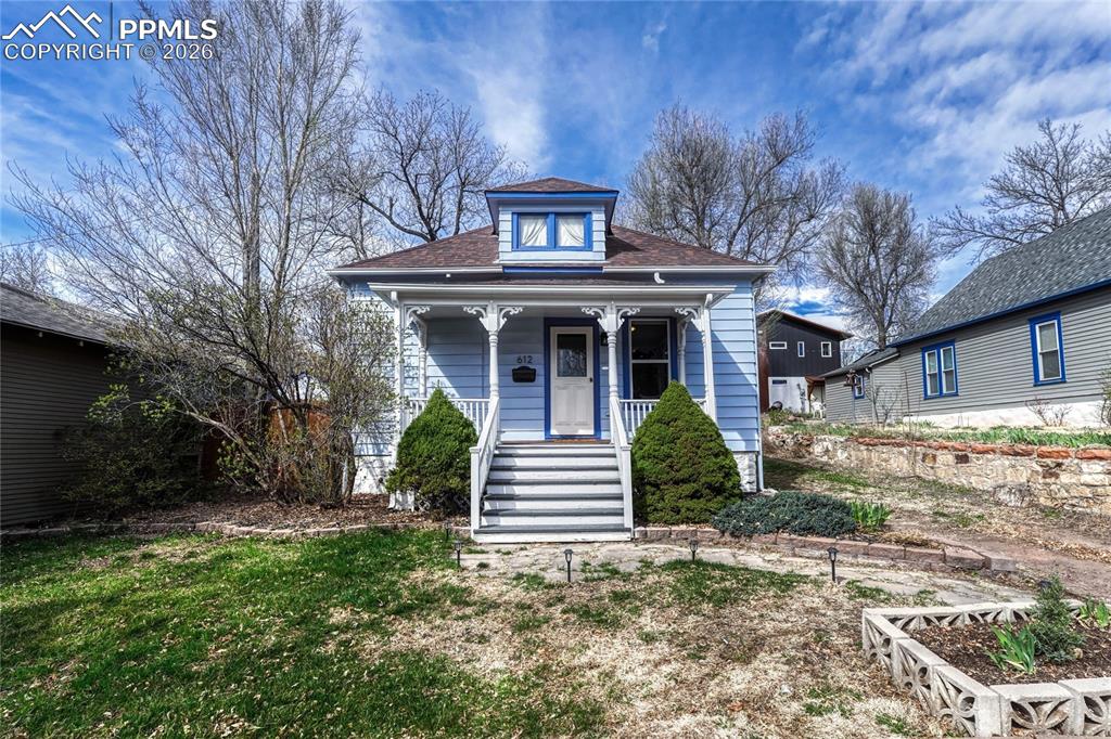 Image 1 of 42: This character-rich home, originally built in 1900, features an inviting co