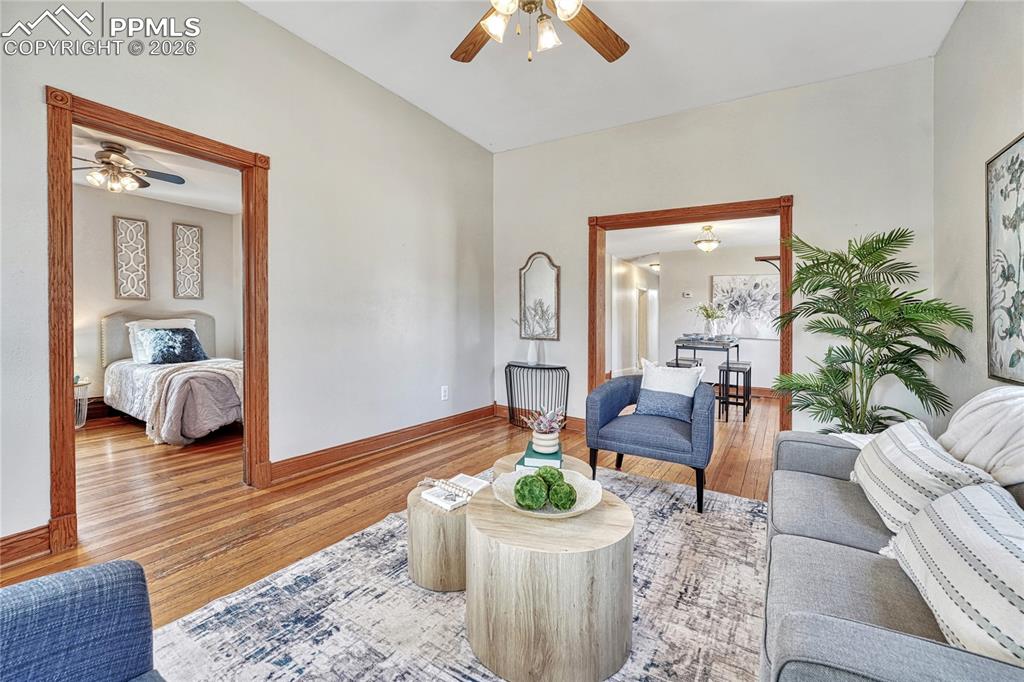 Image 10 of 42: The open floor plan connects the living room to the adjoining dining space