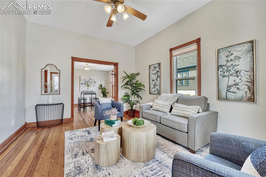 Image 11 of 42: High ceilings and thick baseboards frame the living area, creating an invit