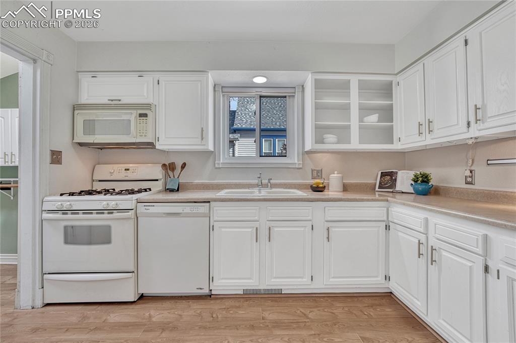 Image 19 of 42: Thoughtfully designed, fully-equipped kitchen with a gas stove and ample wh