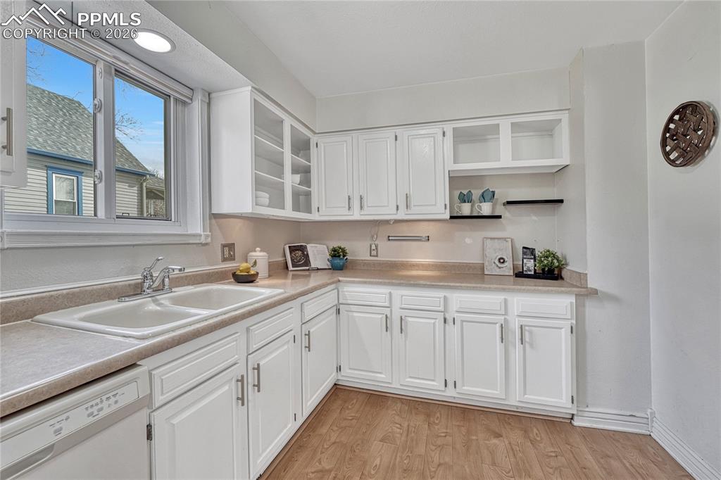 Image 20 of 42: Under lit cabinets provide a great amount of storage for the home