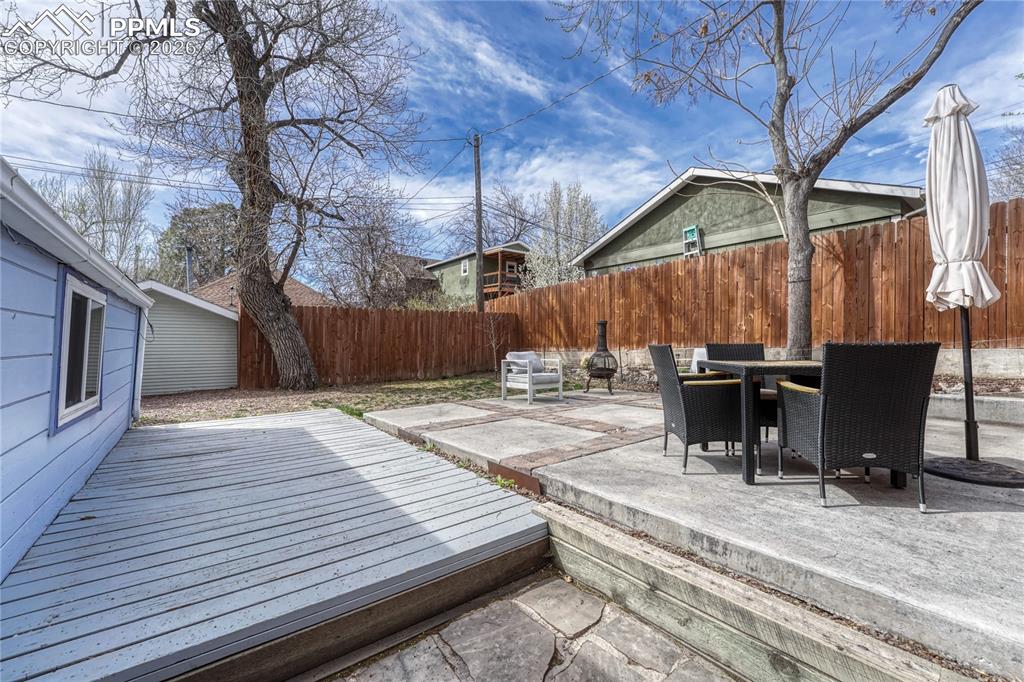 Image 29 of 42: Fully fenced-in for privacy, this level outdoor space provides a peaceful r
