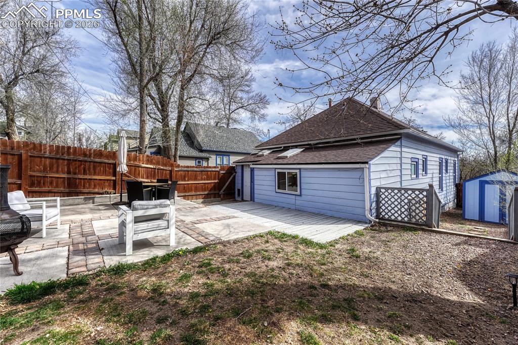 Image 32 of 42: The rear exterior showcases the home