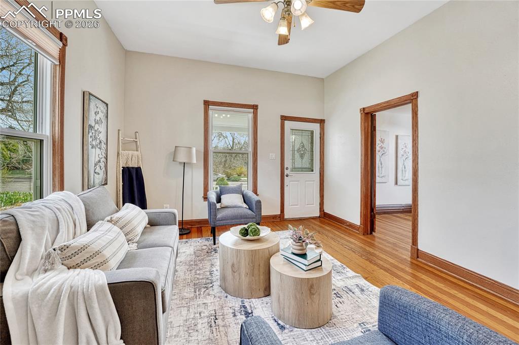 Image 6 of 42: Historic, beautiful oak trim and thick baseboards emphasize the home
