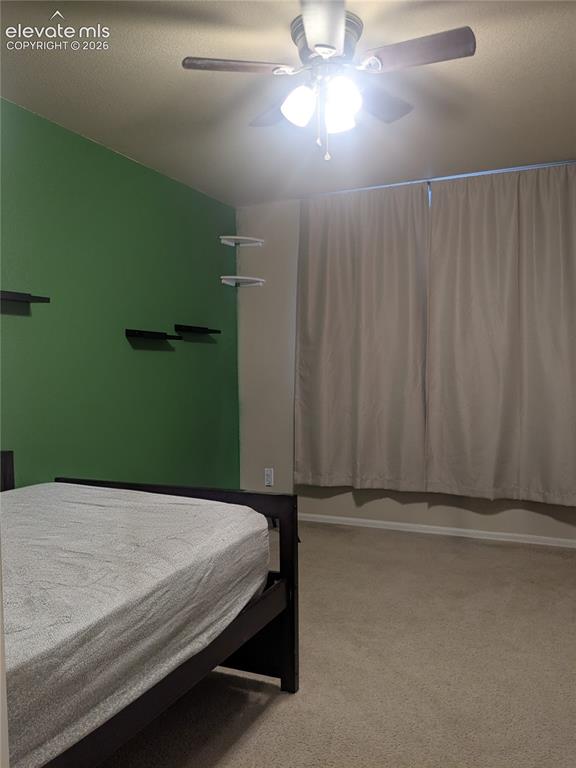 Image 10 of 33: Spacious room that could be a dining room or office featuring vaulted ceili