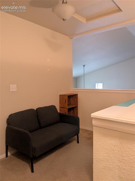 Image 20 of 33: This room features a window with white blinds and curtains, a ceiling fan w