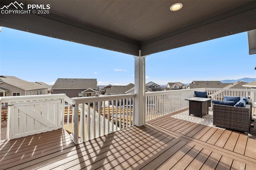 Image 14 of 45: Wooden deck with a residential view and an outdoor living space