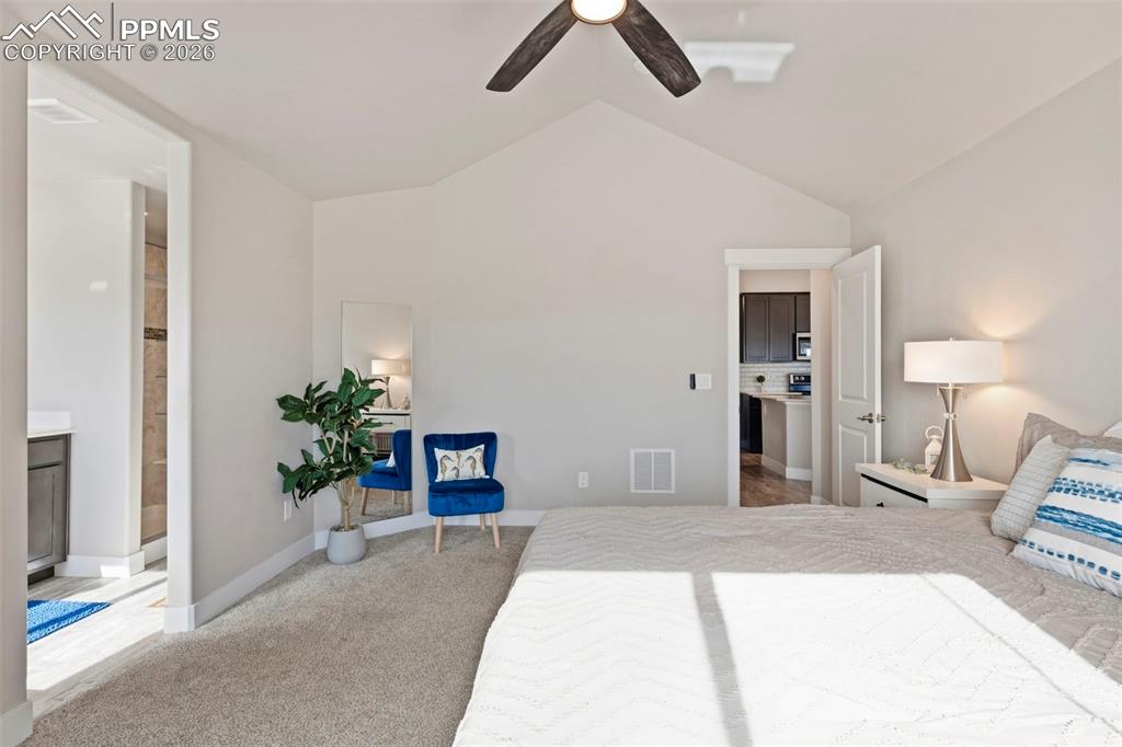 Image 21 of 45: Bedroom with light carpet and ceiling fan