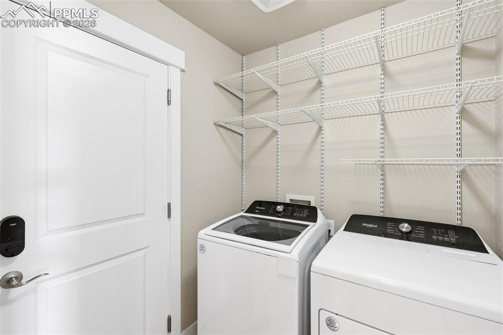 Image 26 of 45: Laundry room with independent washer and dryer