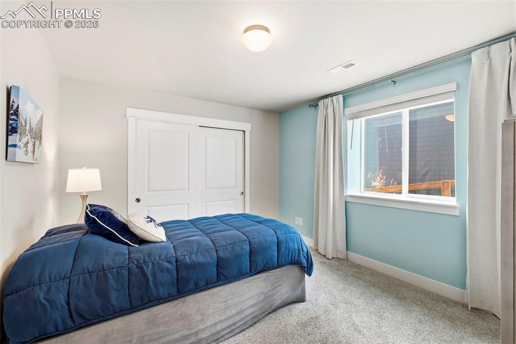 Image 31 of 45: Bedroom featuring carpet floors and a closet