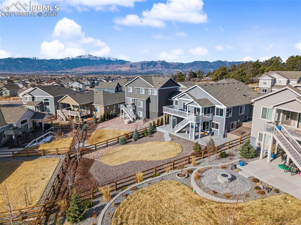 Image 44 of 45: Aerial view of residential area with a mountainous background