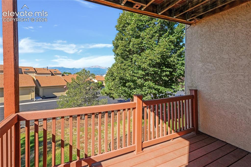 Image 10 of 33: Deck off of the main level dining room