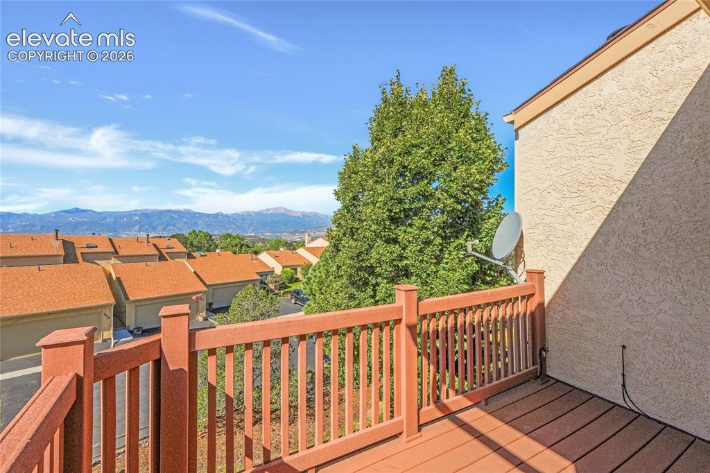 Image 15 of 33: Deck from primary ensuite with mountain and city views