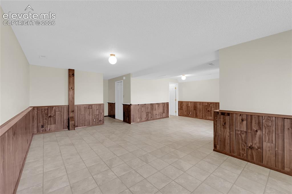 Image 21 of 33: Flex space possible bedroom/family room/private entrance.