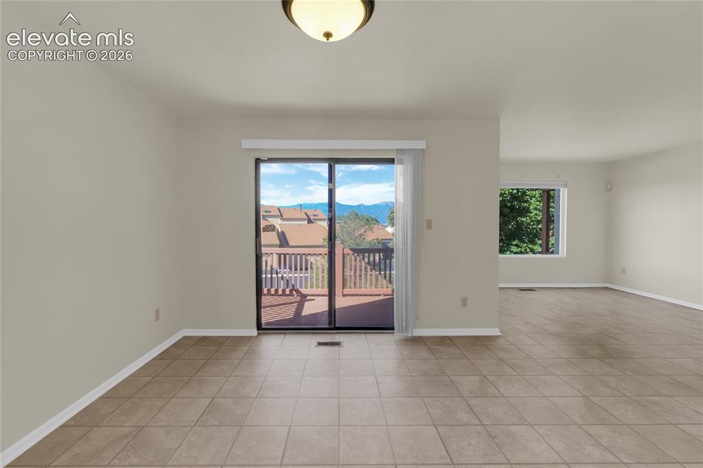 Image 9 of 33: Dining Area with Walkout to Deck