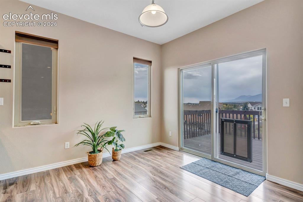 Image 12 of 46: Dining area walks out to the south-facing composite deck!
