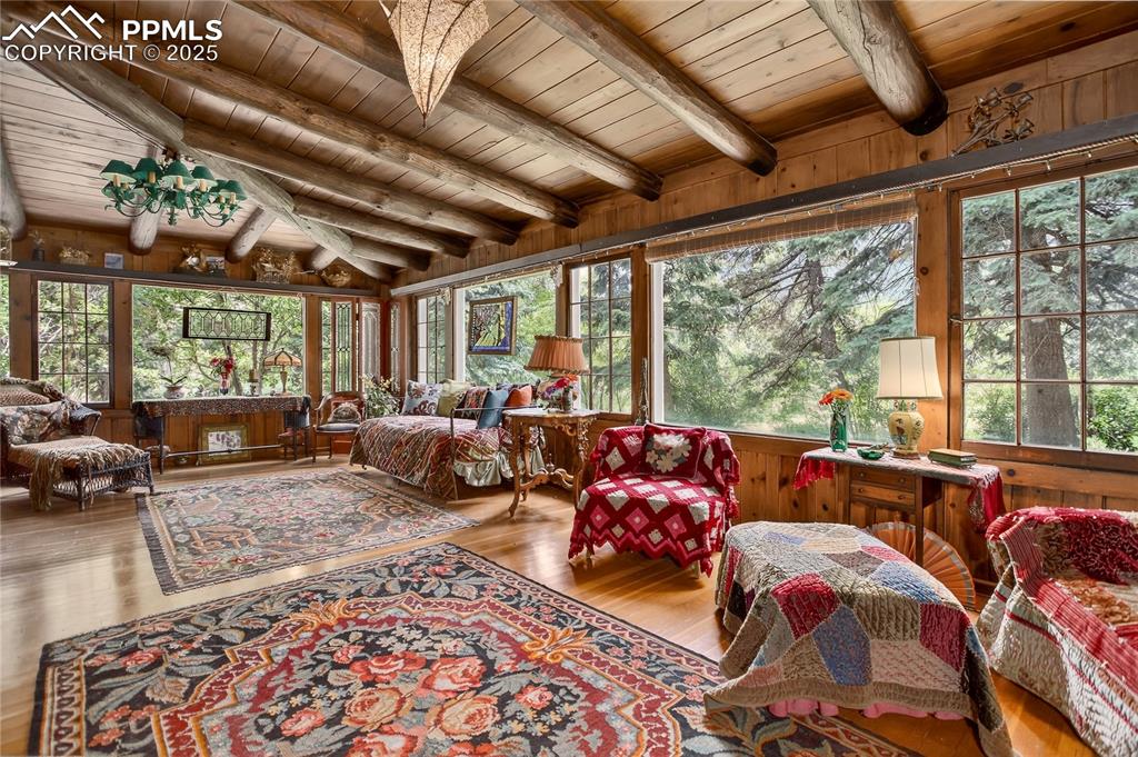 Image 16 of 41: Sun Parlor with wall-to-wall windows