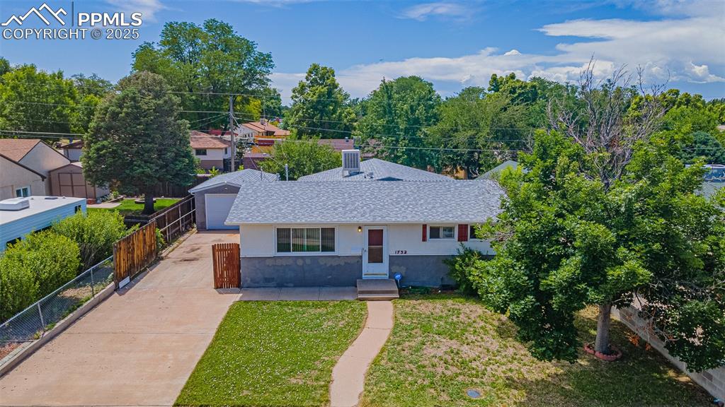 Image 24 of 24: View of front of property featuring a shingled roof and driveway
