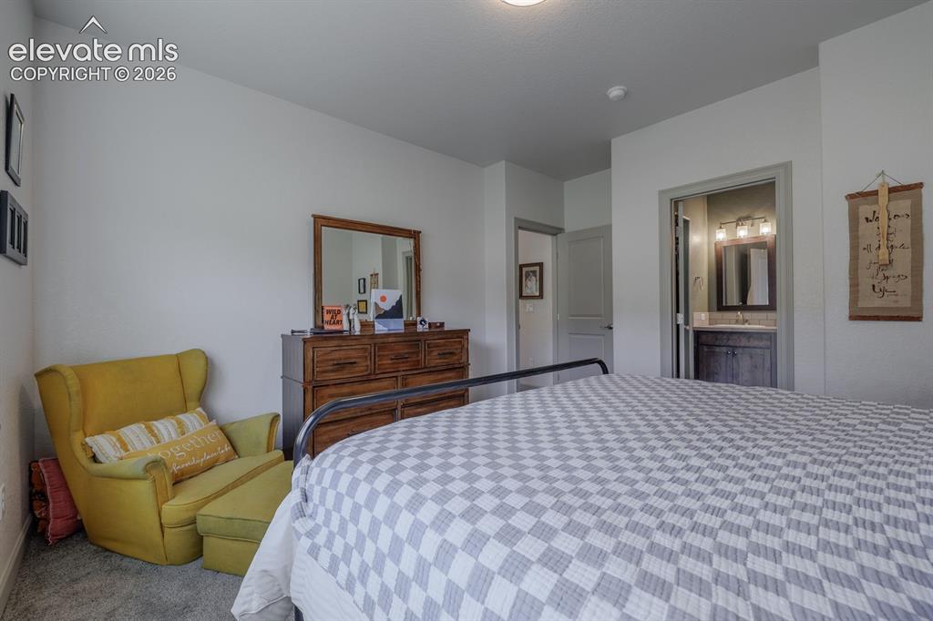 Image 10 of 16: White wall finishes, carpeted flooring, recessed lighting, and a neutral co