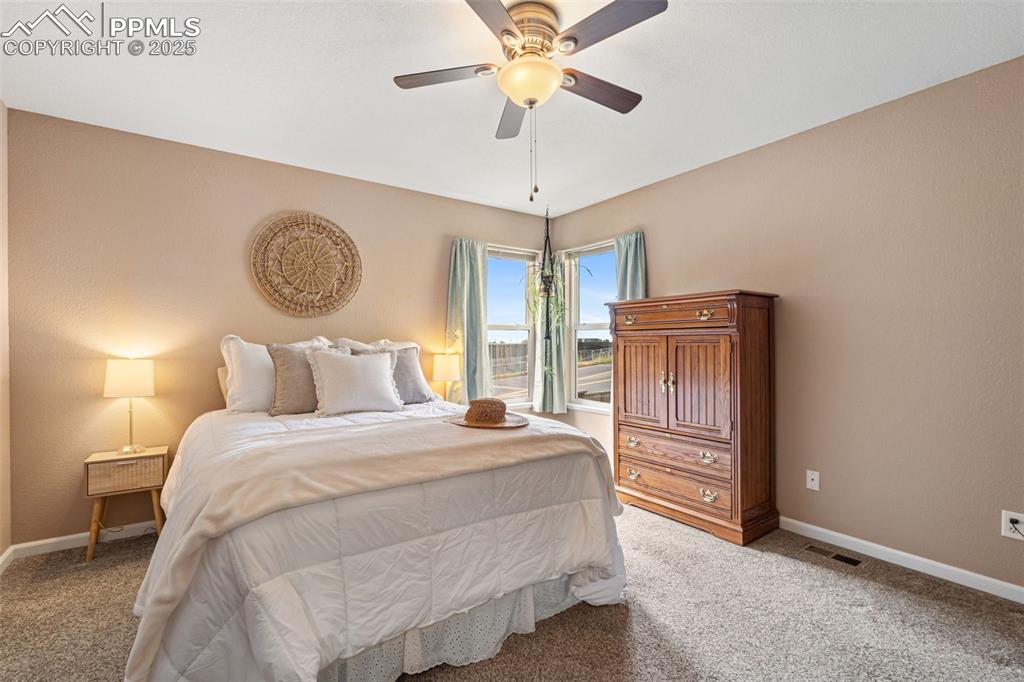 Image 11 of 36: Bedroom featuring carpet and ceiling fan